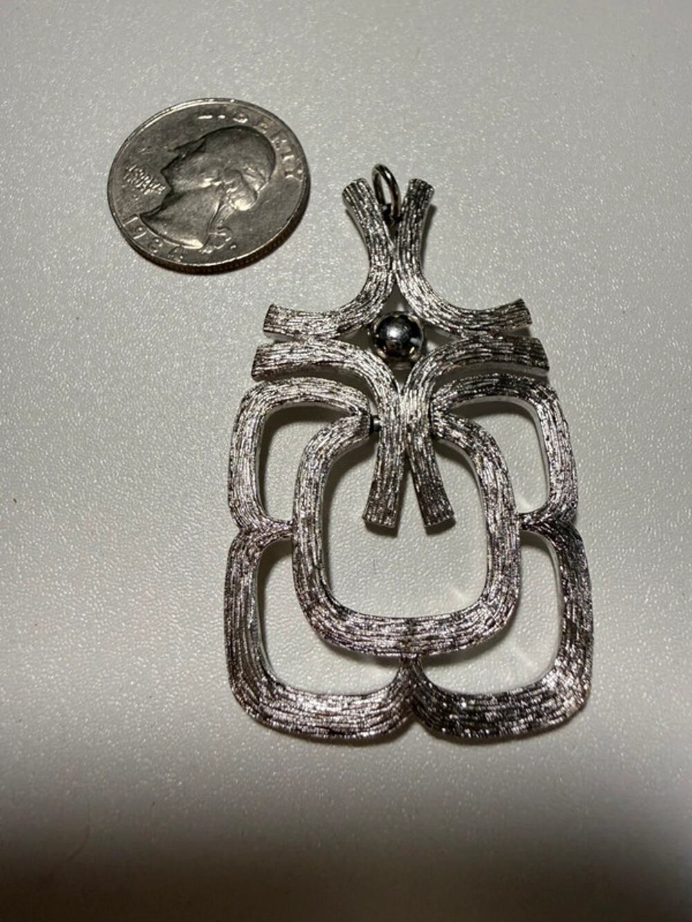 Silver tone geometric abstract pendant for necklace